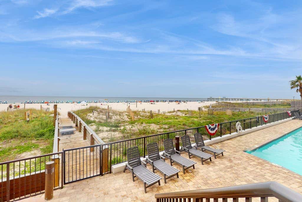 Beachfront condo with shared Gulf front outdoor pool, heated indoor pool, & sauna