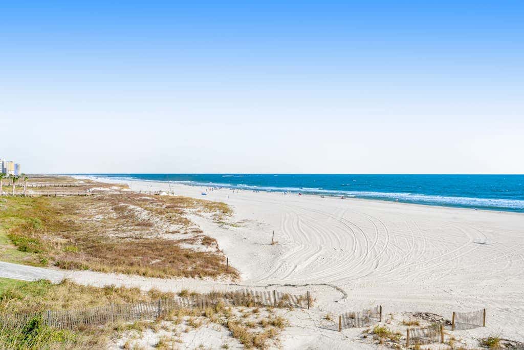 Beachfront condo with shared Gulf front outdoor pool, heated indoor pool, & sauna