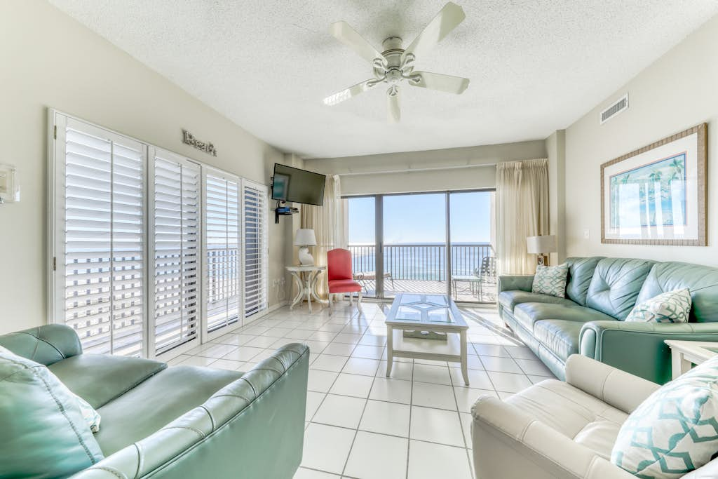 Waterfront corner condo with shared pools, wrap-around balcony, & tennis courts