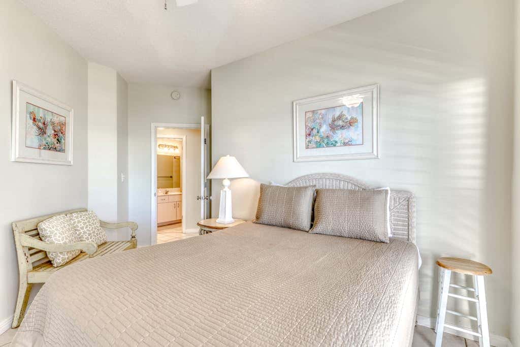 Waterfront corner condo with shared pools, wrap-around balcony, & tennis courts