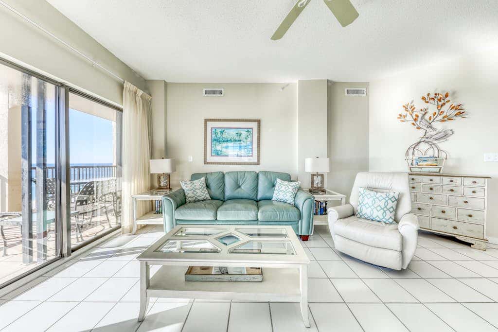 Waterfront corner condo with shared pools, wrap-around balcony, & tennis courts