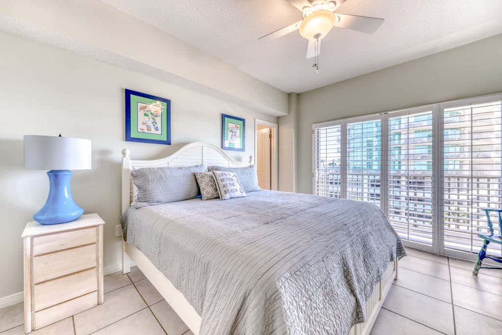 Waterfront corner condo with shared pools, wrap-around balcony, & tennis courts
