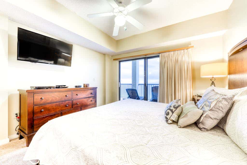 Beachfront condo with shared outdoor pool, heated indoor pool, sauna, & grill area