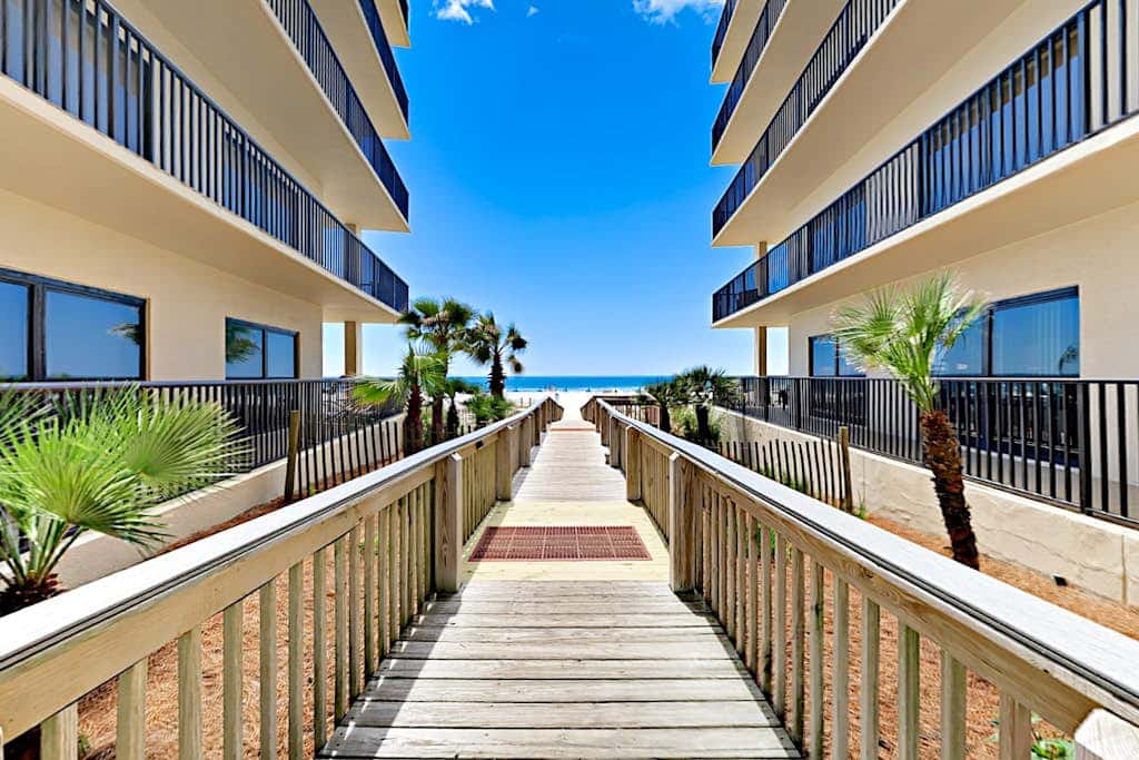 Beachfront condo with shared outdoor pool, heated indoor pool, sauna, & grill area