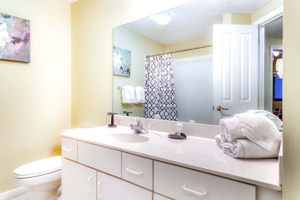 Beachfront condo with shared outdoor pool, heated indoor pool, sauna, & grill area