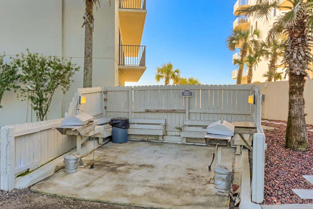 Beachfront condo with shared outdoor pool, heated indoor pool, sauna, & grill area