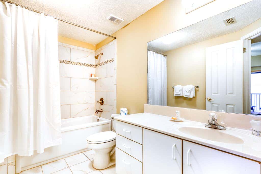 Beachfront condo with shared outdoor pool, heated indoor pool, sauna, & grill area
