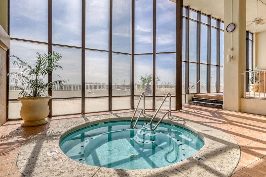 Gulf front condo with pools, hot tub - ocean view, covered balcony & washer, dryer