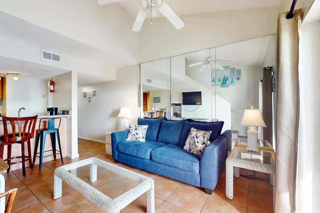 Gulf view condo with a full kitchen, private balcony, shared pools, & tennis court