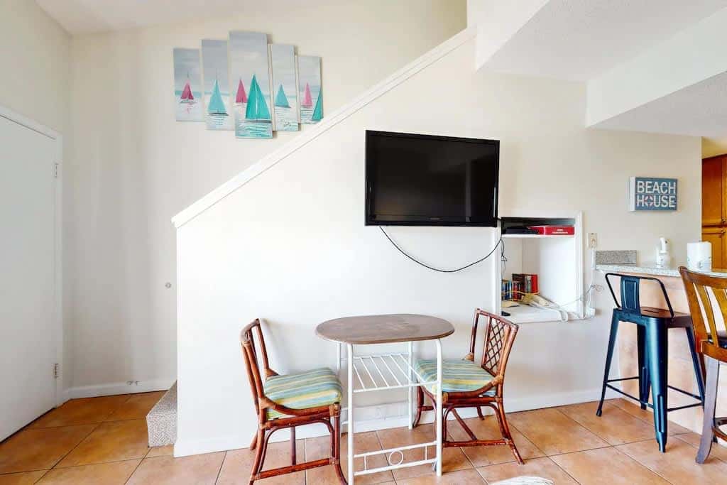 Gulf view condo with a full kitchen, private balcony, shared pools, & tennis court