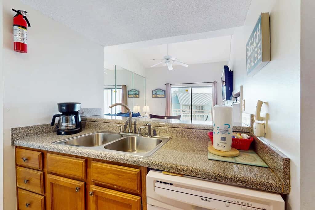 Gulf view condo with a full kitchen, private balcony, shared pools, & tennis court