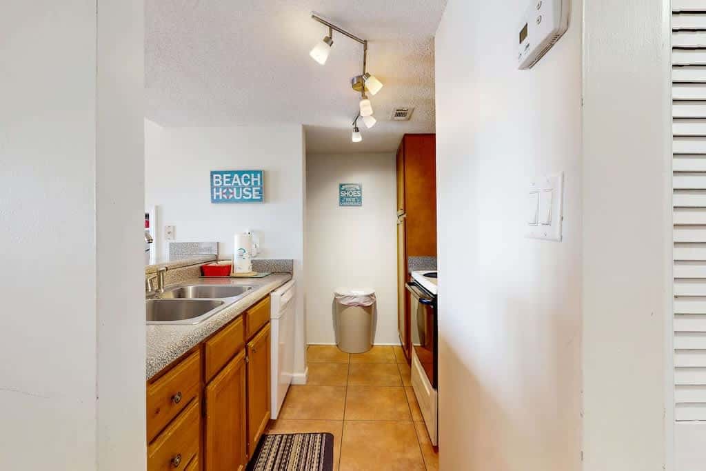Gulf view condo with a full kitchen, private balcony, shared pools, & tennis court