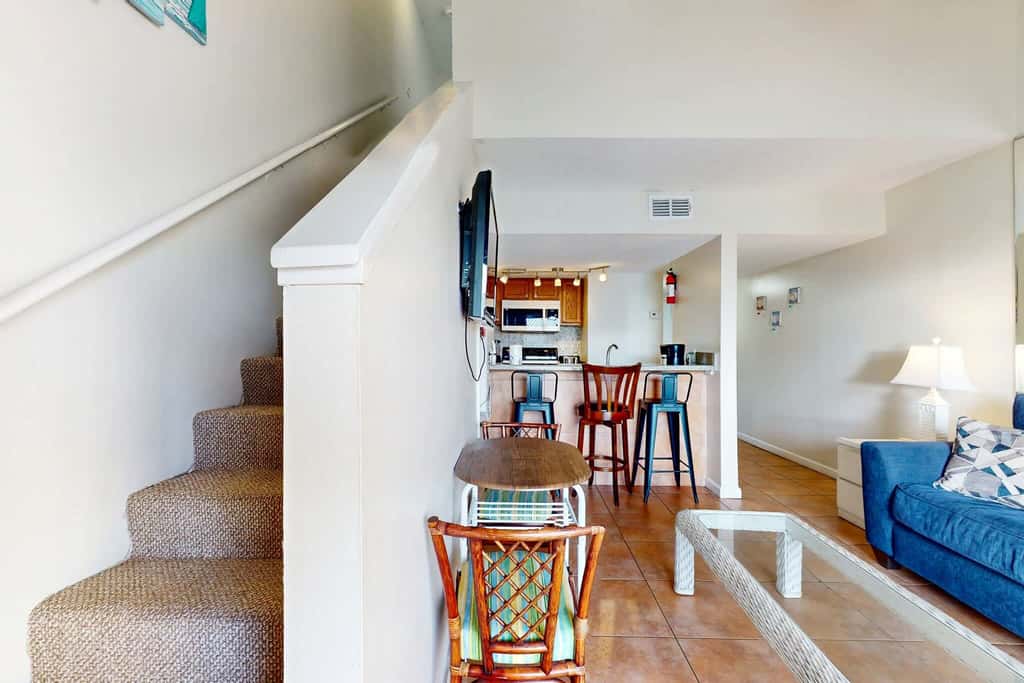 Gulf view condo with a full kitchen, private balcony, shared pools, & tennis court