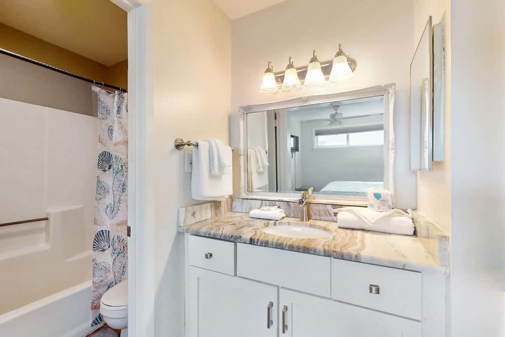 Gulf view condo with a full kitchen, private balcony, shared pools, & tennis court
