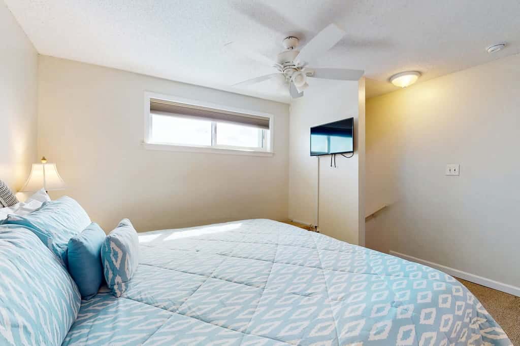 Gulf view condo with a full kitchen, private balcony, shared pools, & tennis court