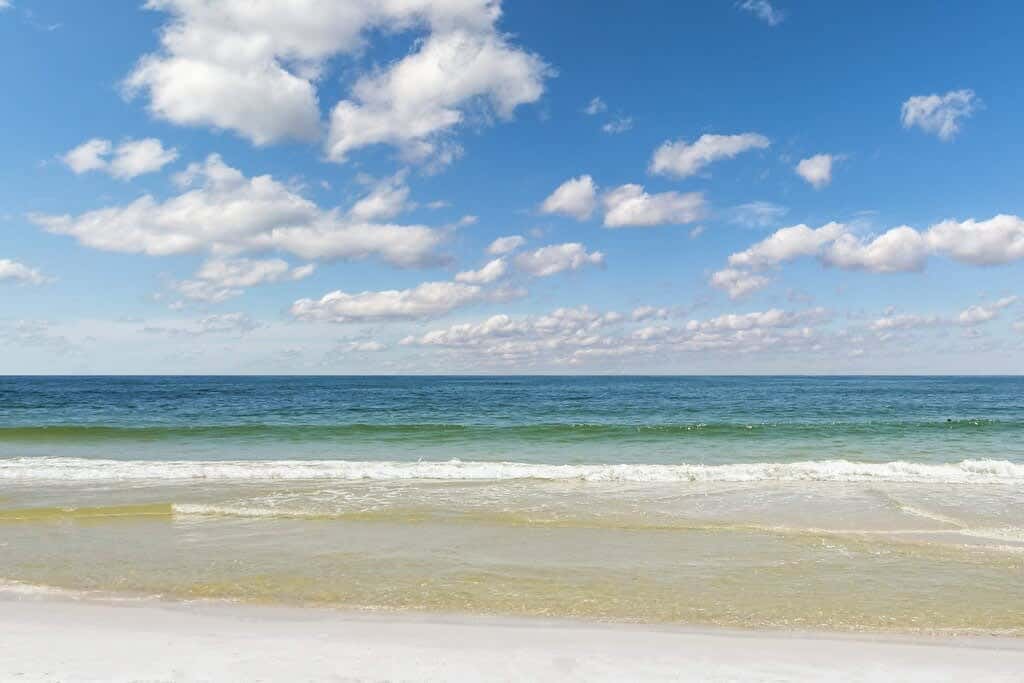 Gulf view condo with a full kitchen, private balcony, shared pools, & tennis court