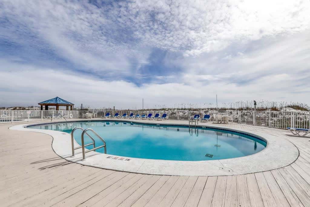 Gulf view condo with a full kitchen, private balcony, shared pools, & tennis court