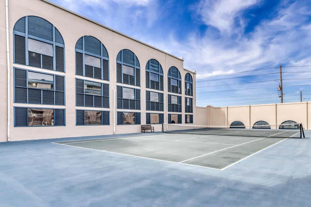 Gulf view condo with a full kitchen, private balcony, shared pools, & tennis court