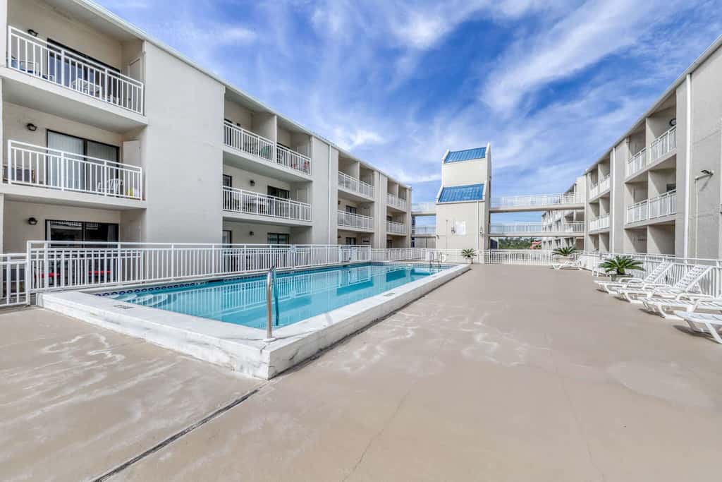 Gulf view condo with a full kitchen, private balcony, shared pools, & tennis court