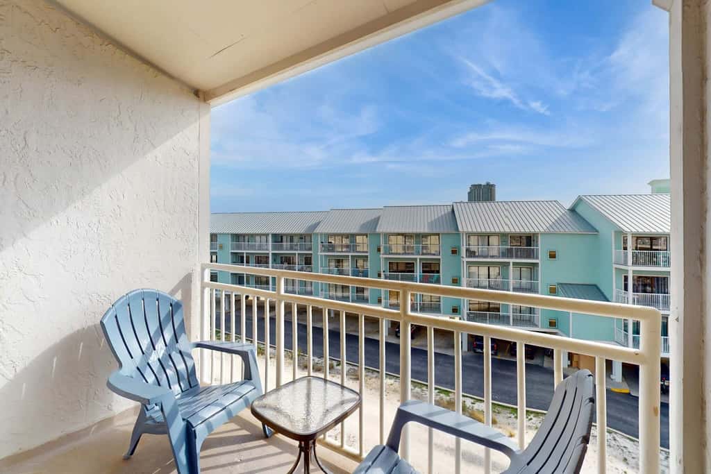 Gulf view condo with a full kitchen, private balcony, shared pools, & tennis court