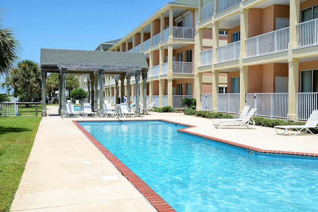 Newly renovated second-floor condo with shared pool, WiFi, W/D, & central AC