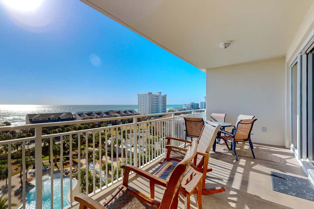 7th floor condo with ocean views, shared pool, central AC, and washer&dryer