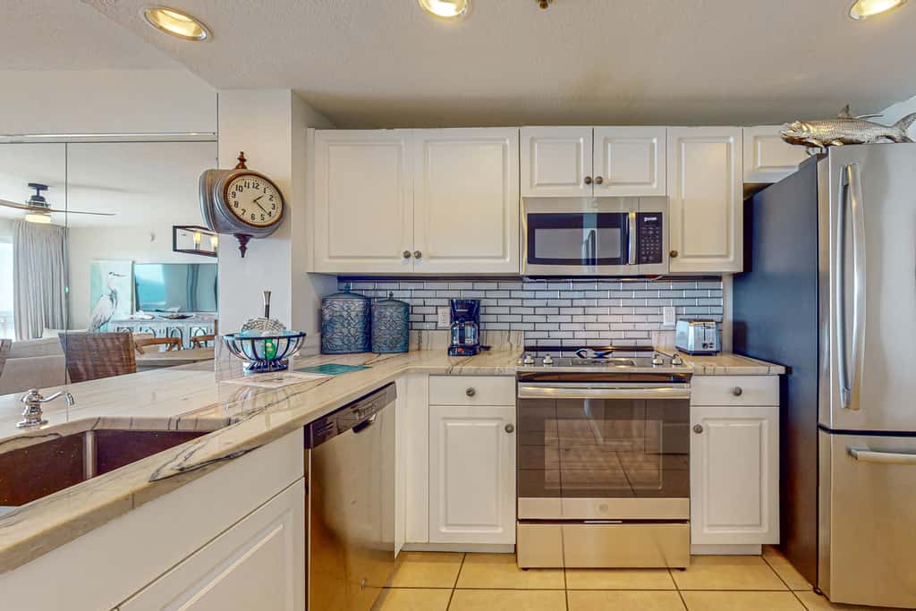 7th floor condo with ocean views, shared pool, central AC, and washer&dryer