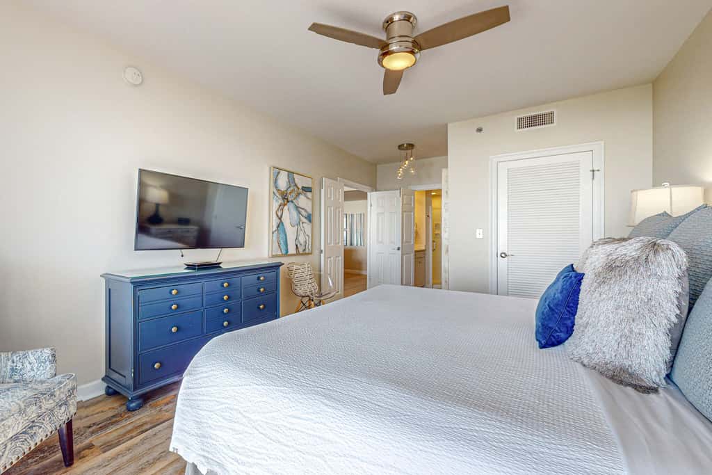 7th floor condo with ocean views, shared pool, central AC, and washer&dryer
