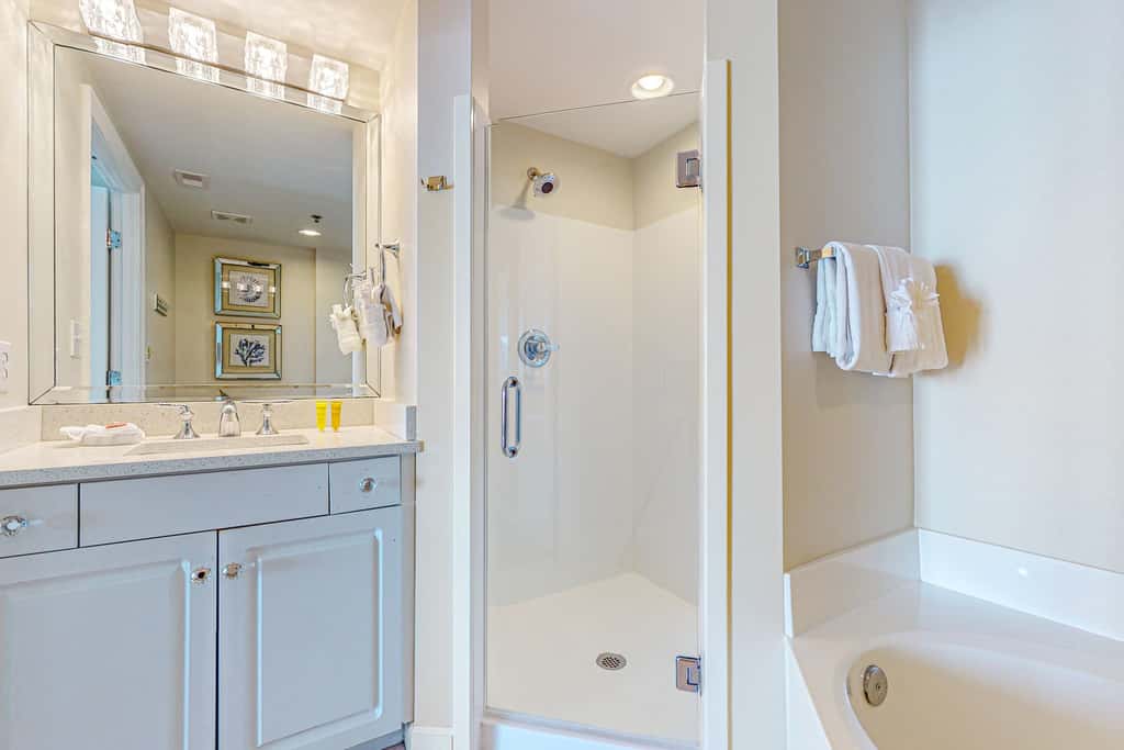7th floor condo with ocean views, shared pool, central AC, and washer&dryer