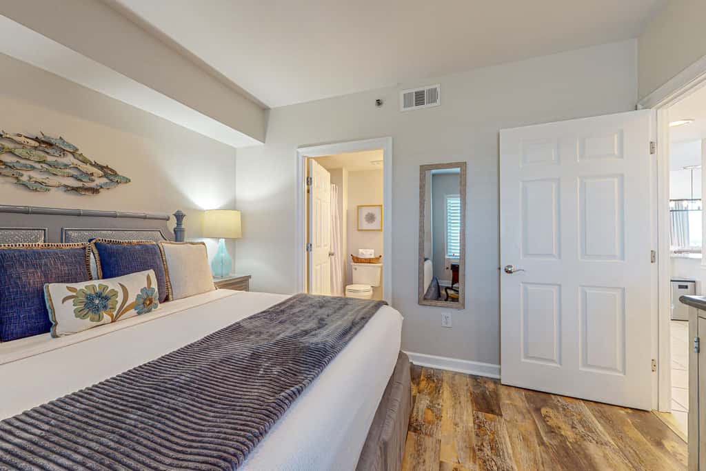 7th floor condo with ocean views, shared pool, central AC, and washer&dryer