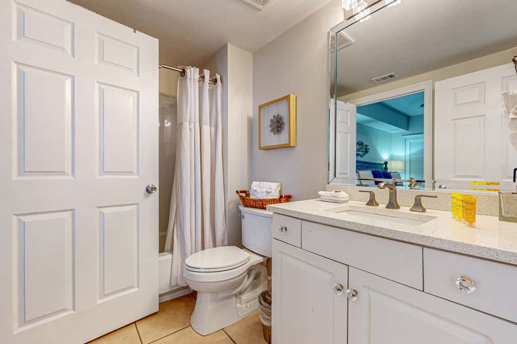 7th floor condo with ocean views, shared pool, central AC, and washer&dryer