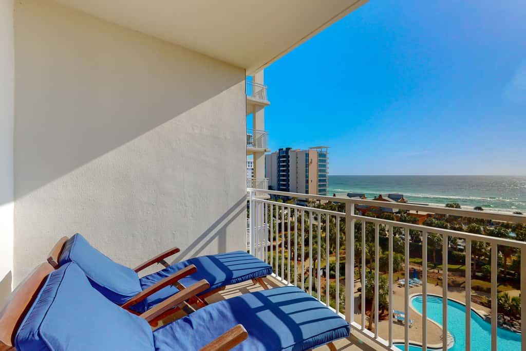 7th floor condo with ocean views, shared pool, central AC, and washer&dryer