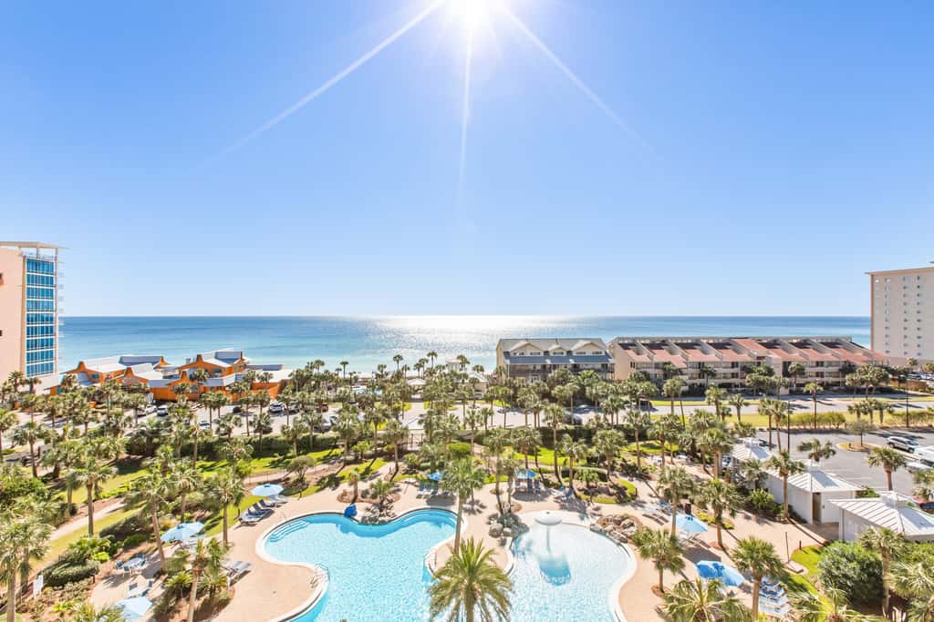 7th floor condo with ocean views, shared pool, central AC, and washer&dryer