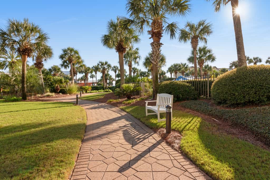 7th floor condo with ocean views, shared pool, central AC, and washer&dryer