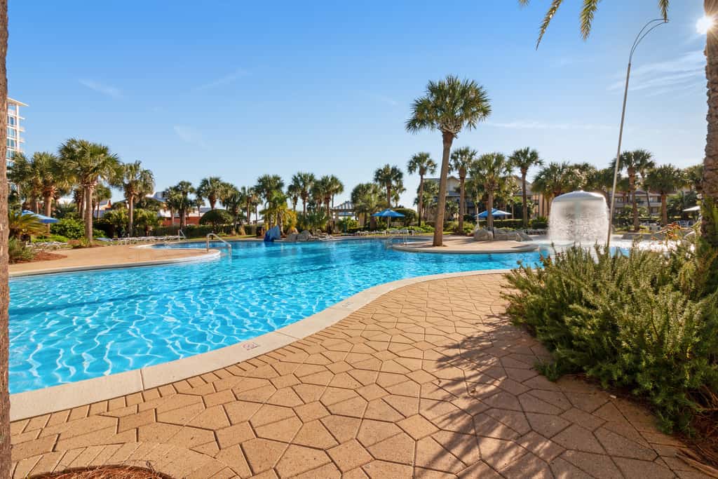 7th floor condo with ocean views, shared pool, central AC, and washer&dryer