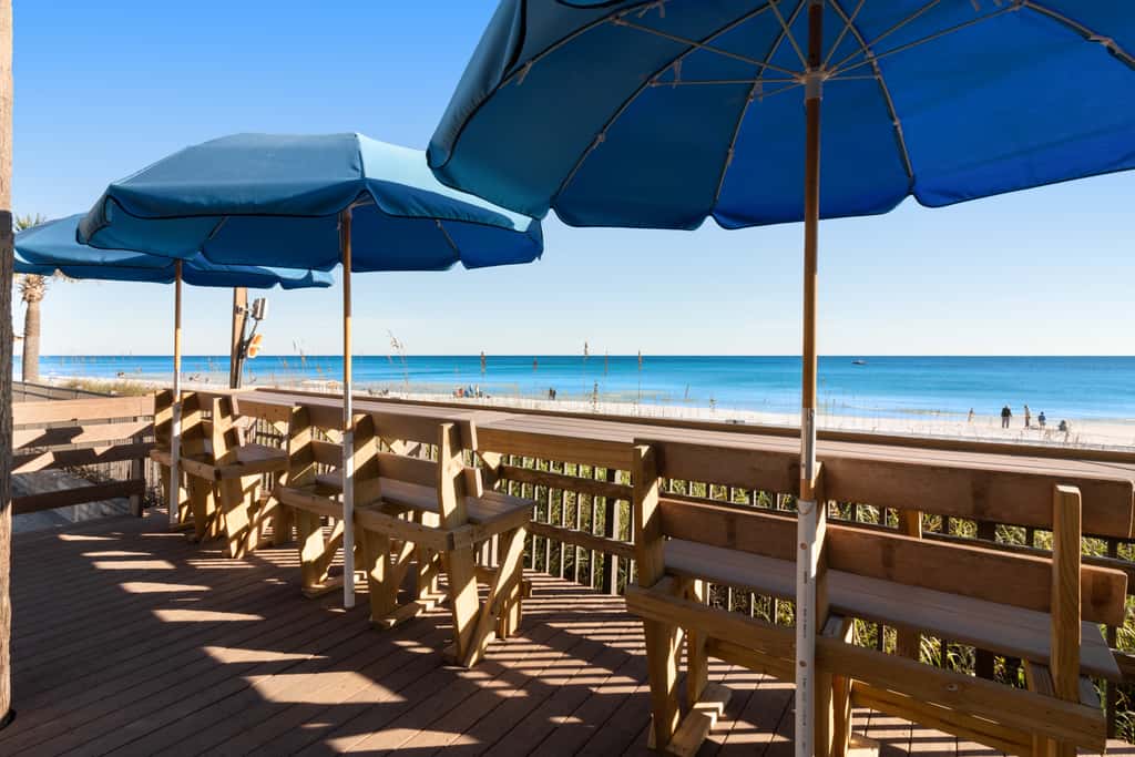 7th floor condo with ocean views, shared pool, central AC, and washer&dryer