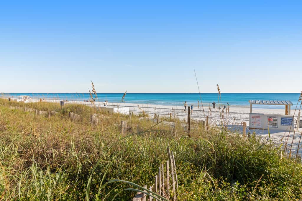 7th floor condo with ocean views, shared pool, central AC, and washer&dryer