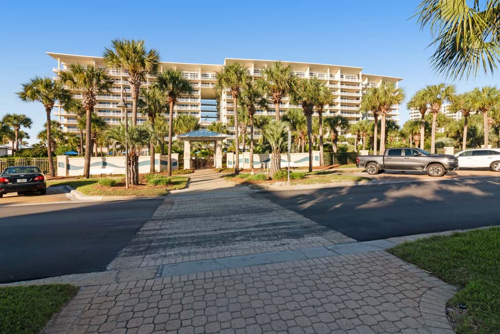 7th floor condo with ocean views, shared pool, central AC, and washer&dryer