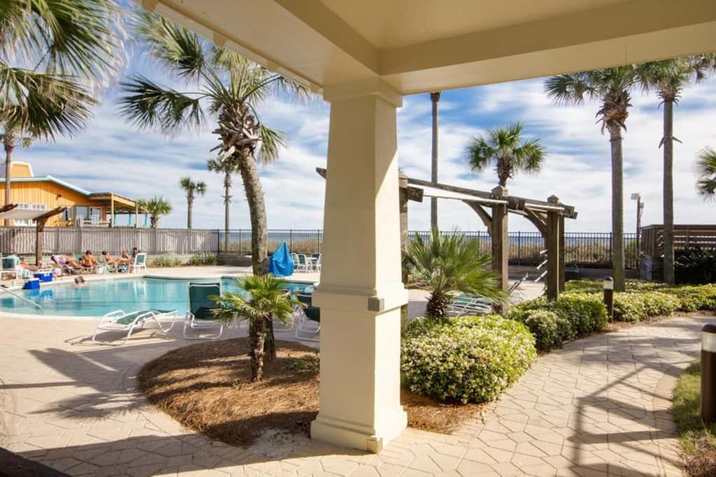 7th floor condo with ocean views, shared pool, central AC, and washer&dryer
