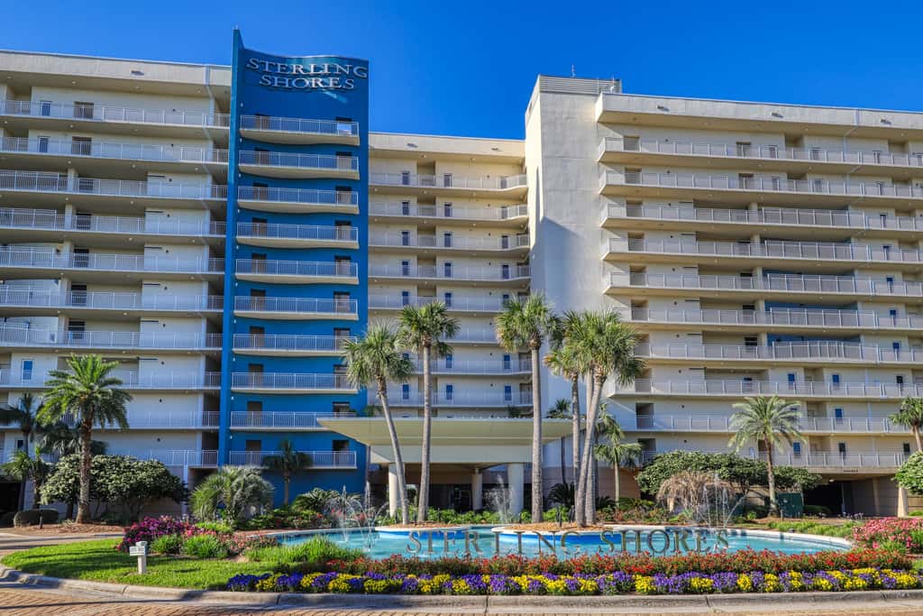 7th floor condo with ocean views, shared pool, central AC, and washer&dryer