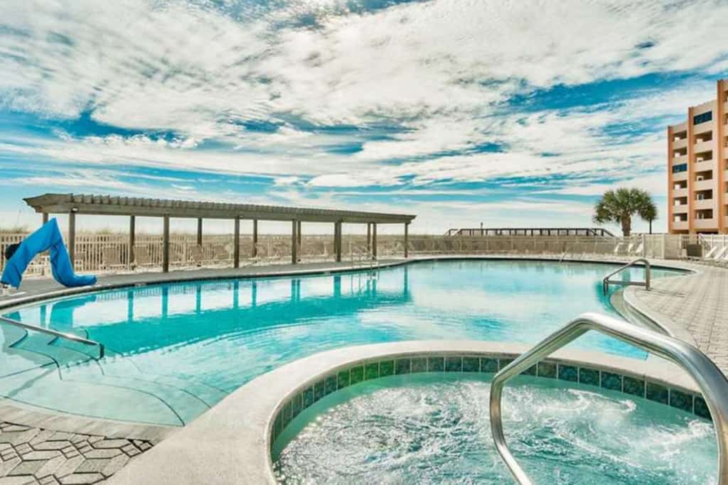 Fourth Floor Oceanfront Condo with Shared Pool, Ocean View, Laundry, and AC