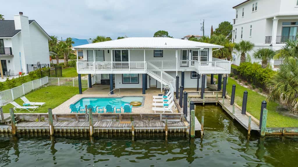 Canal-front home with pool, 40' boat slip, gated beach access - 1 block to sand