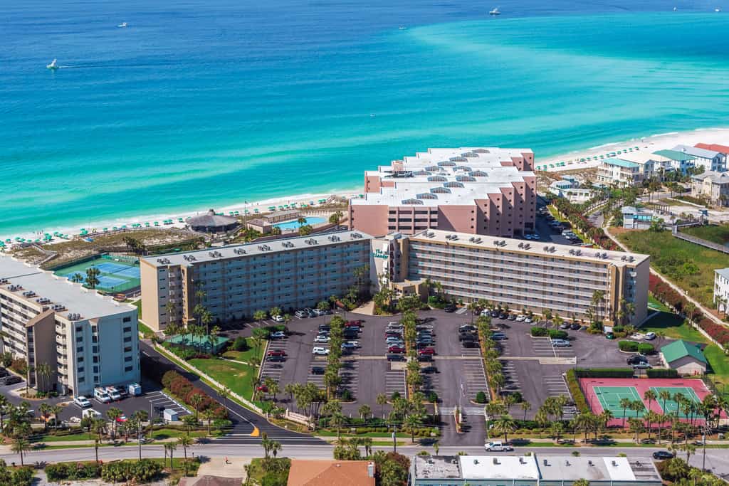 Condo in oceanfront complex with pools, private beach access, and balcony
