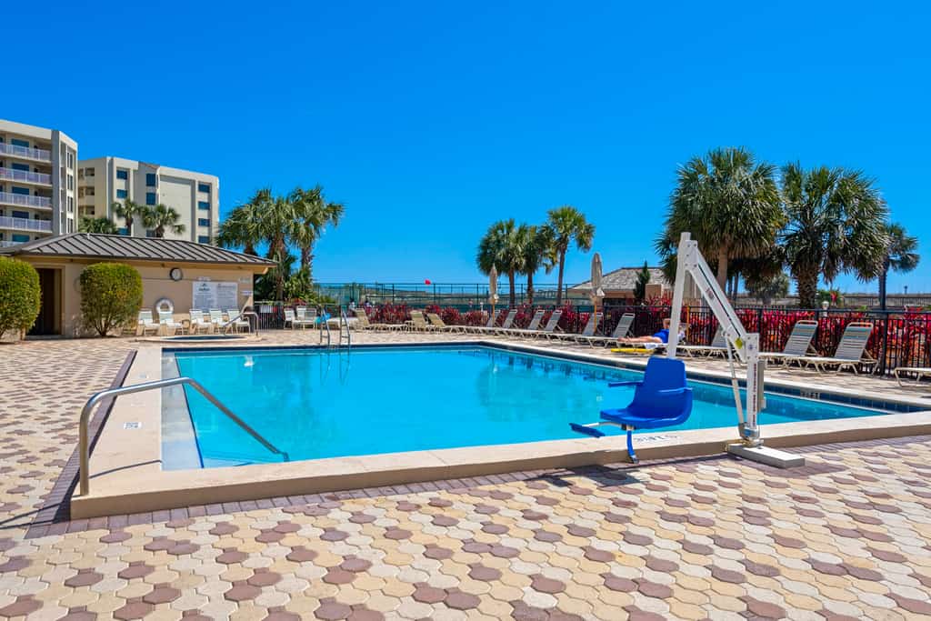 Condo in oceanfront complex with pools, private beach access, and balcony