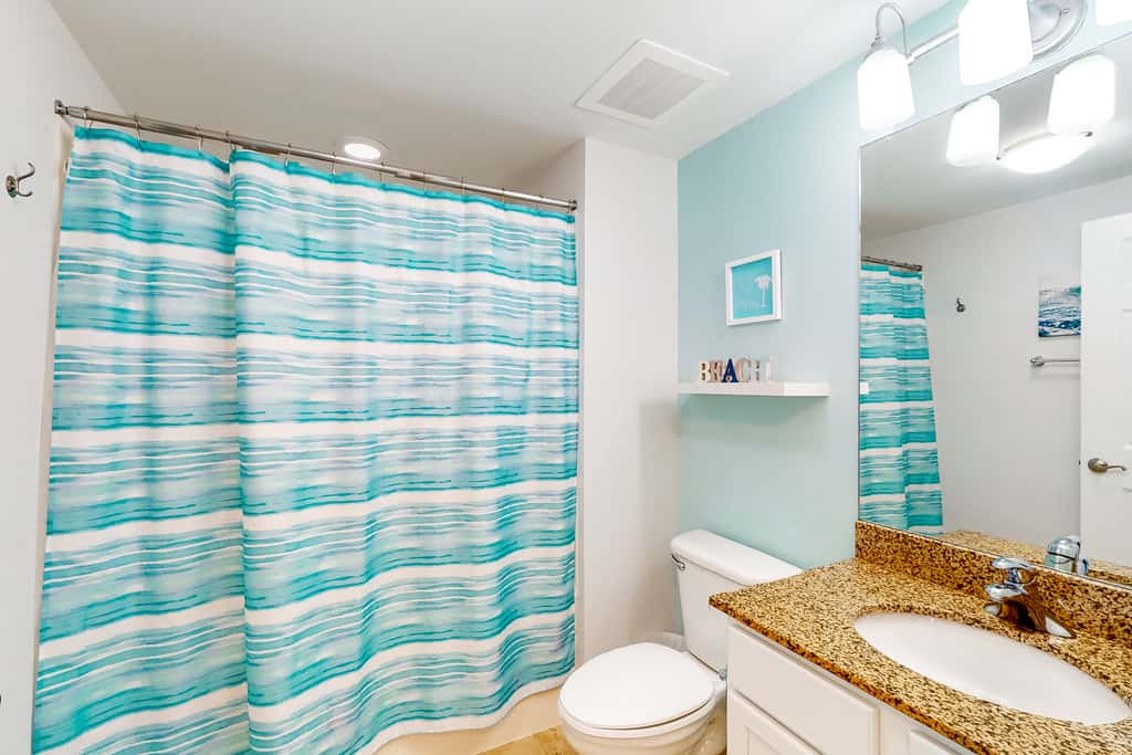 Beachy resort condo with balcony, outdoor pools, hot tub, gym, tennis, AC, & W&D