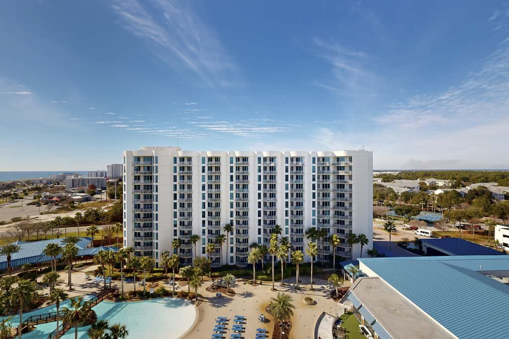 Water-view 11th-floor condo with hot tub, heated pool, tennis, sauna, gym, W/D