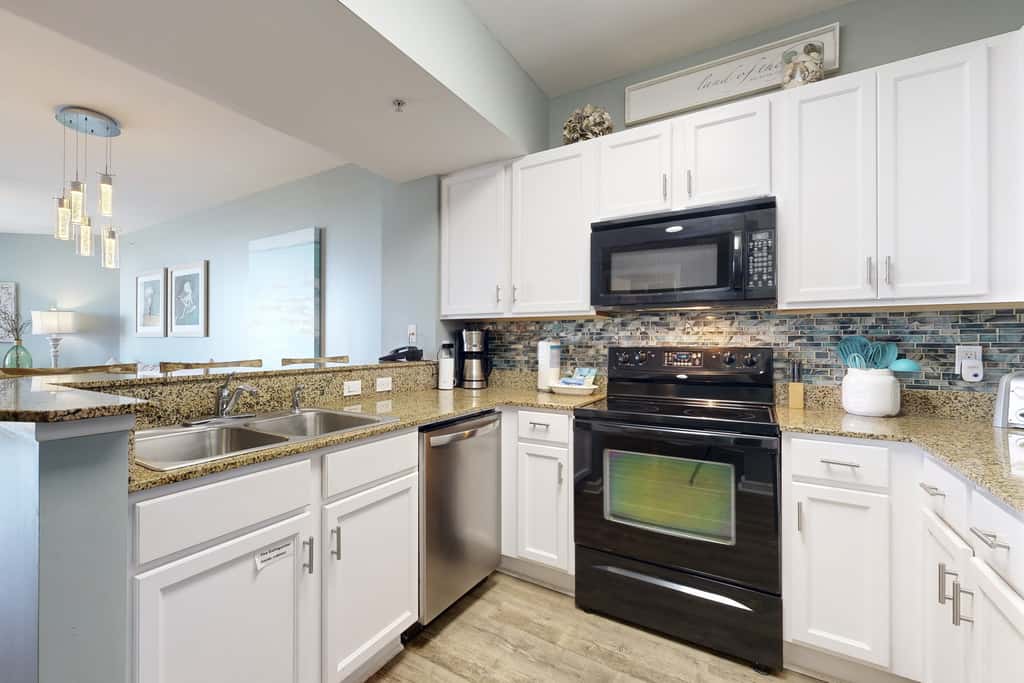 Water-view 11th-floor condo with hot tub, heated pool, tennis, sauna, gym, W/D
