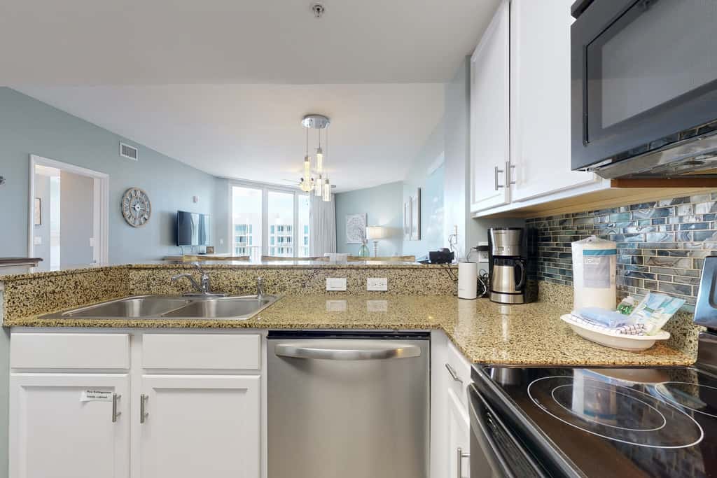 Water-view 11th-floor condo with hot tub, heated pool, tennis, sauna, gym, W/D
