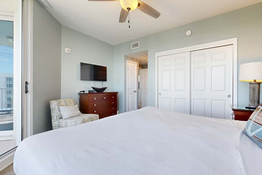 Water-view 11th-floor condo with hot tub, heated pool, tennis, sauna, gym, W/D