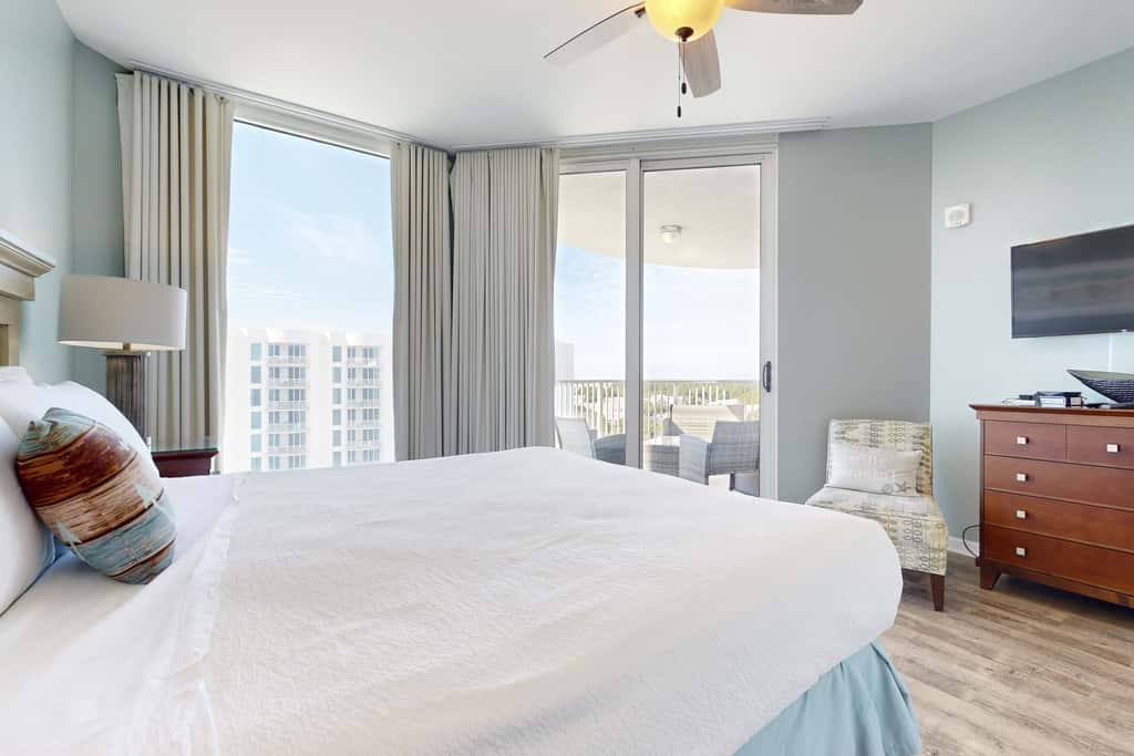 Water-view 11th-floor condo with hot tub, heated pool, tennis, sauna, gym, W/D